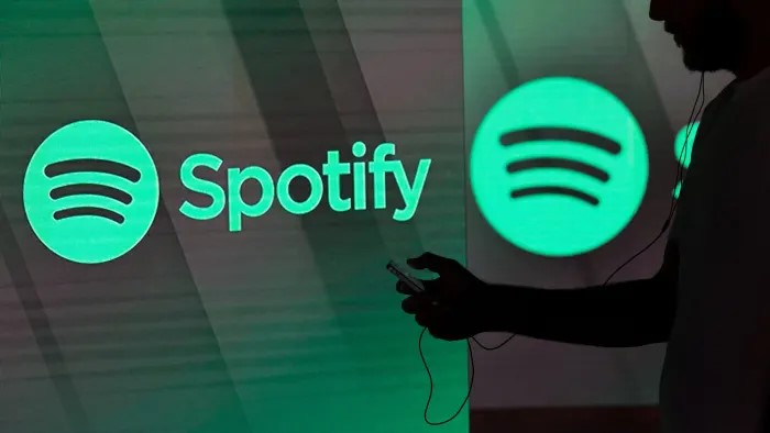 User Downloading Spotify Songs to Phone